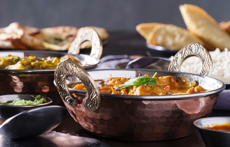 Die neue Curry-Kreation wird in einer Art Wok, dem Balti, zubereitet. Bild: Joshua Resnick - stock.adobe.com