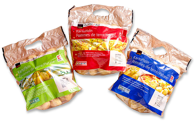 Les pommes de terre à chair ferme sont emballées dans des sacs verts, les farineuses (rösti, frites) dans des sacs rouges ou bleus (purée).